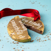 Medal broken up to reveal chunky Belgian milk chocolate middle