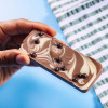 Swirled milk and white chocolate bar with crunchy chocolate crispearls.