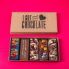 Gift box with five handmade chocolate bars, including “Bun in. Oven on.” – a light-hearted treat for expecting parents who appreciate good chocolate and a bit of cheek.