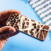 Honeycomb crunch bar made with Belgian milk chocolate plus sprinkles and white chocolate drizzle