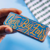 'Cheer big ears' in colourful typography transferred onto a milk chocolate bar.