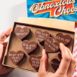 Bagstock & Bumble Get Well Obnoxious Chocs being held up, filled with Belgian chocolate hearts and cheeky slogans – the ultimate funny get well gift.