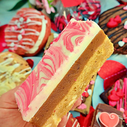 Creamy white chocolate and gooey caramel layers, finished with a marbled pink and white chocolate top