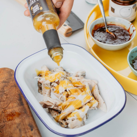 mango and habanero hot sauce poured on chicken