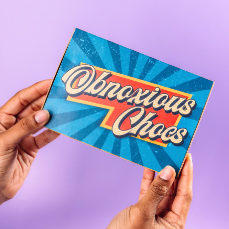 Bold and colourful vintage-style Obnoxious Chocs packaging from Bagstock & Bumble, designed ready to gift for mums-to-be who appreciate a bit of cheek.