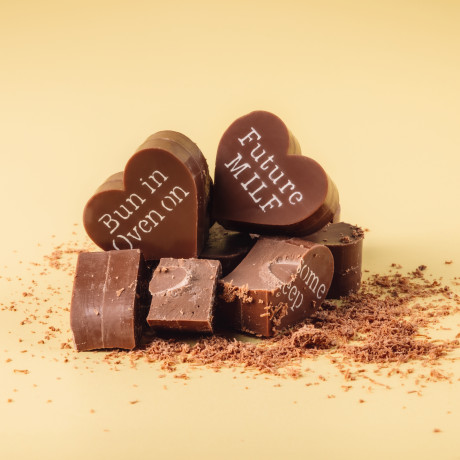 Broken pieces of Bagstock & Bumble pregnancy chocolates revealing the thick, premium Fairtrade Belgian chocolate inside – made for proper indulgence.