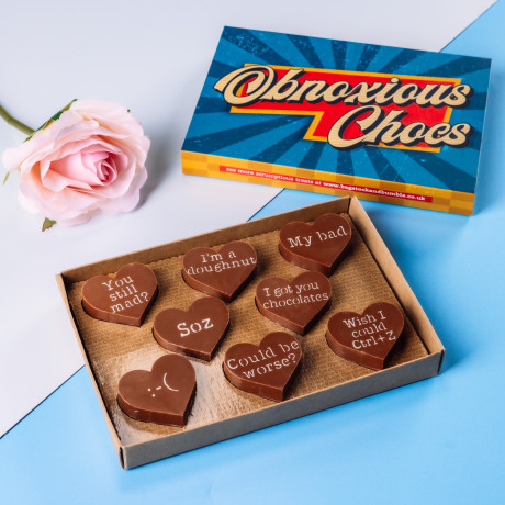 Sorry Obnoxious Chocs from Bagstock & Bumble pictured in the box next to the retro packaging, ready to hand straight over.