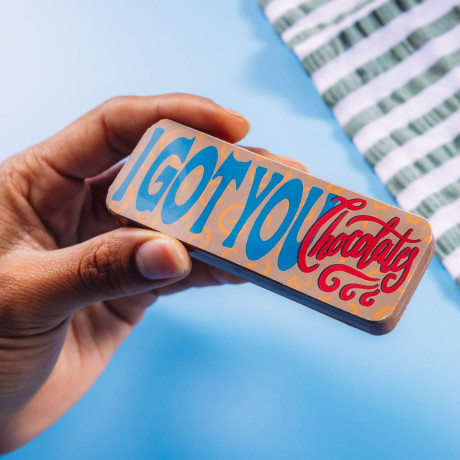 A chocolate bar that says ‘I Tolerate You’ in colourful typography