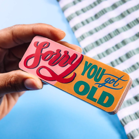 Treat sized, retro-styled picture bar with a 'Sorry you got old' slogan