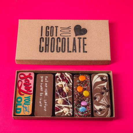 Open kraft gift box with “I Got You Chocolate” branding, showing five quirky handmade chocolate bars – a birthday gift with a bit of character.